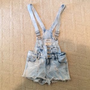 Distressed jean overalls